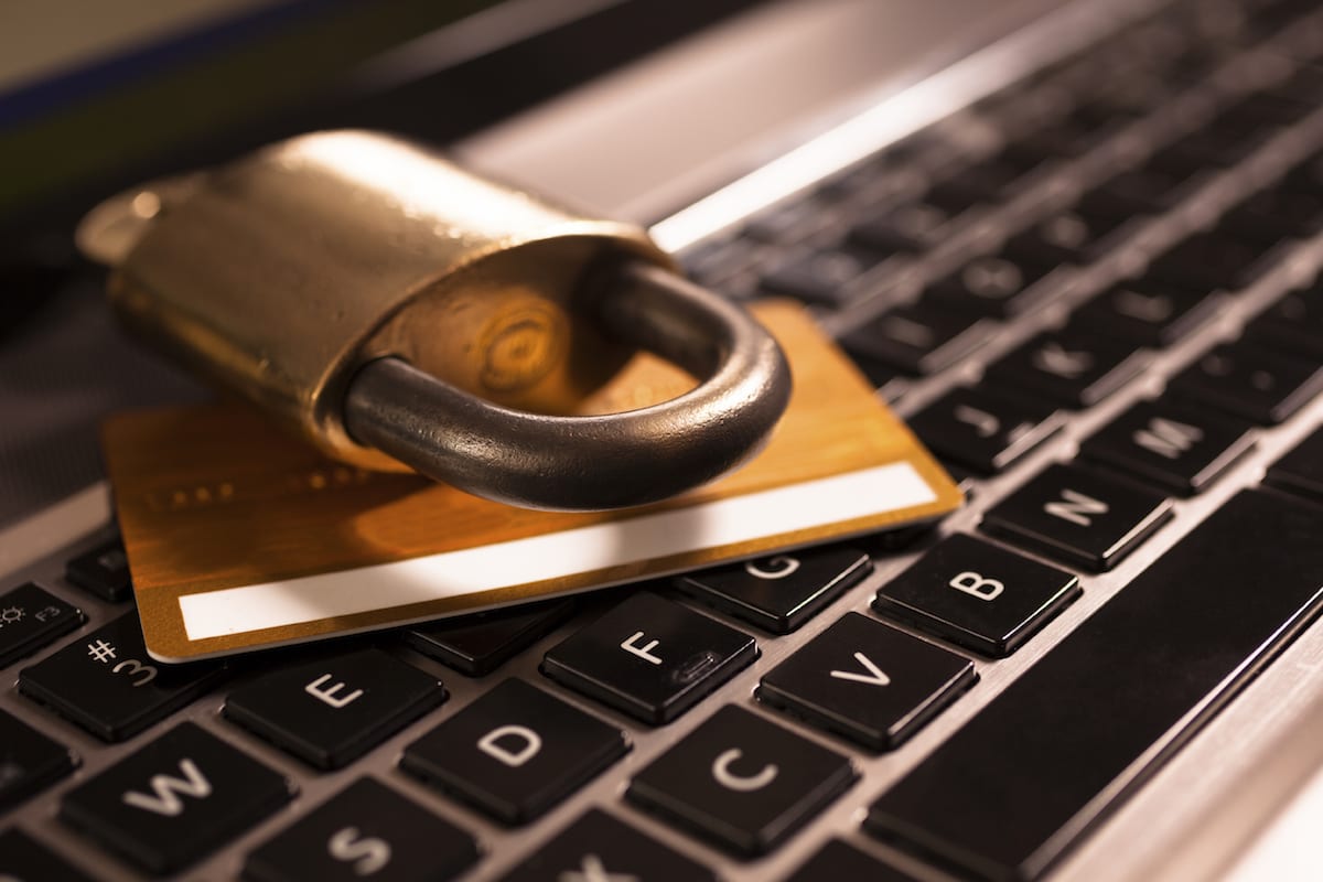 photo of a lock and credit card sitting on laptop keyboard