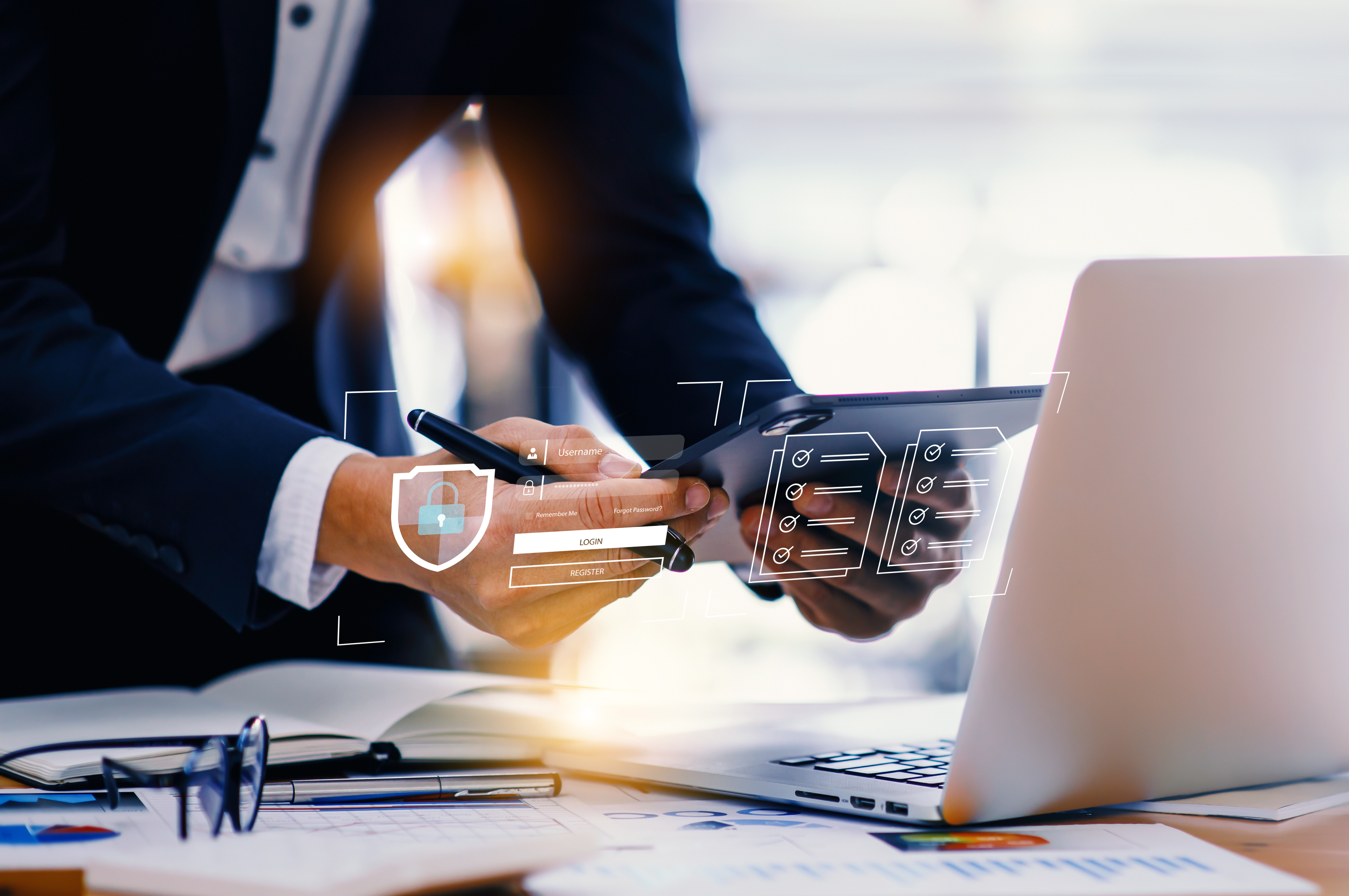 business man in front of laptop sending confidential data