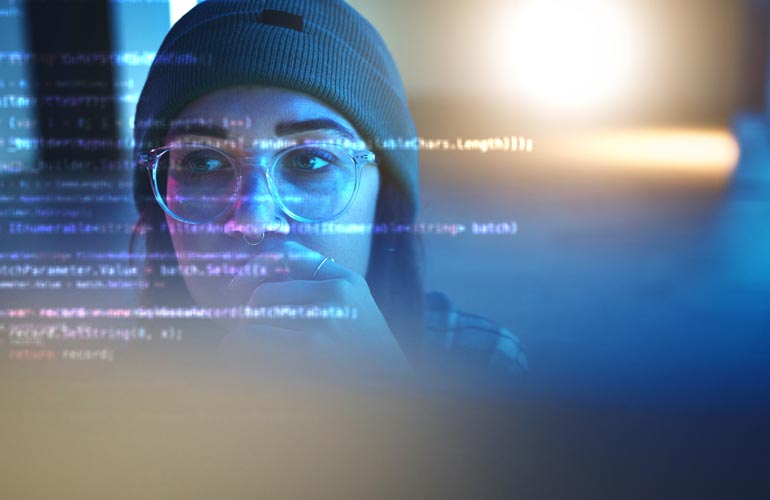Programmer, code or woman hacker in dark room