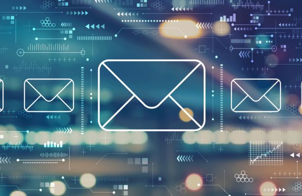 Email icons over digital circuitry; concept of electronic communication