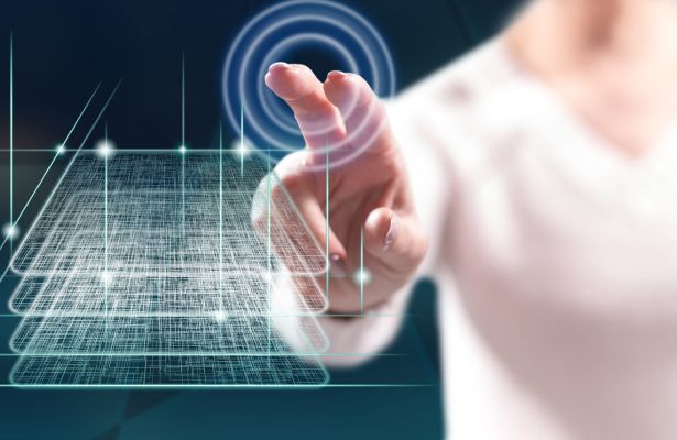 man interacting with a touch screen that has layers