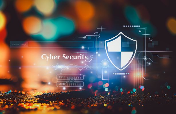 shield icon and user log in boxes floating in the air next to the words cyber security over a blurred background