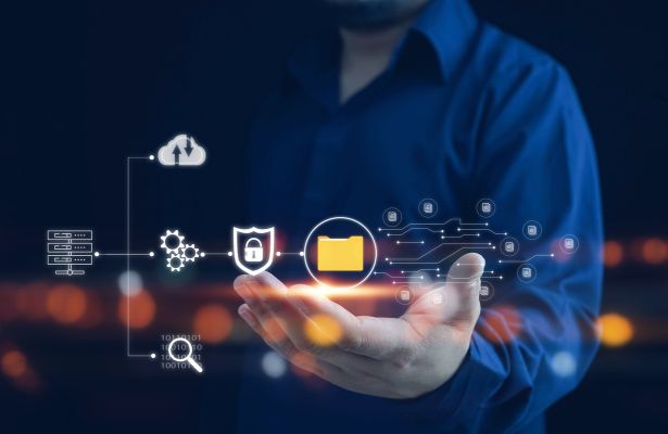 man holding up icons showing data transfer process
