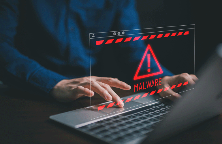 man typing on keyboard with warning overlay