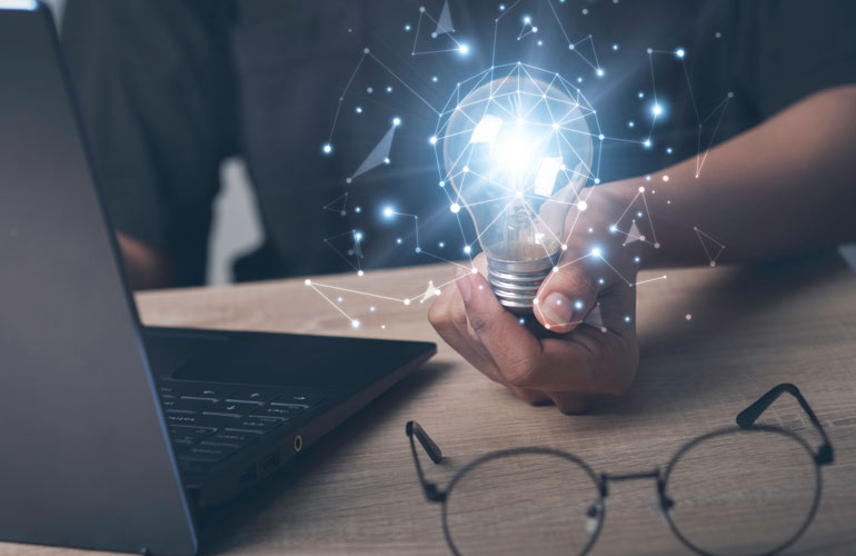 eLearning concept illustration, hand holding light bulb